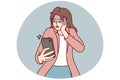 Frightened woman looks into mobile phone after seeing unpleasant sms message. Vector image Royalty Free Stock Photo