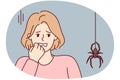 Frightened woman puts hand to face sees large spider descending from ceiling along web. Vector image