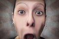 Frightened woman screaming with mouth wide open Royalty Free Stock Photo