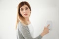 Frightened woman using security system indoors Royalty Free Stock Photo