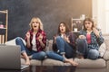 Frightened young women watching movie at home Royalty Free Stock Photo