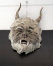 Frightening hide and fur mask with horns and saber teeth in Todos Santos.