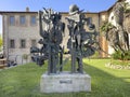 Frightening metal sculpture on a concrete base in Castiglione del Lago, Italy