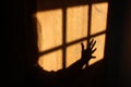 Scary Shadow of a Hand in Reflection of Window