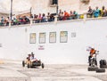 FRIGILIANA, SPAIN - MAY 13, 2018 `Autos Locos` - traditional fun involving the ride of cardboard cars in small spanish town Royalty Free Stock Photo