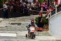 FRIGILIANA, SPAIN - MAY 13, 2018 `Autos Locos` - traditional fun involving the ride of cardboard cars in small spanish town Royalty Free Stock Photo