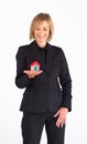 Frinedly mature businesswoman holding a house Royalty Free Stock Photo