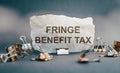 FRINGE BENEFIT TAX. FBT. Text on gray torn paper Royalty Free Stock Photo