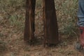 Fringe of cowboy chaps on ranch