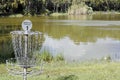 Frisbee Golf Goal by a Lake in a Park Royalty Free Stock Photo