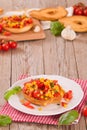 Friselle with tomatoes and mais. Royalty Free Stock Photo