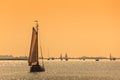 Frisian Dutch sailing ships during sundown Royalty Free Stock Photo