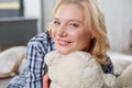 Frisky lady holding close teddy bear