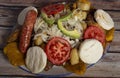 Fritanga or picada, traditional Colombian food. This dish is mainly composed of: beef, chicken, Creole potato, dog kennel, chorizo Royalty Free Stock Photo