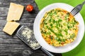 Frittata with deviled eggs, ricotta, onion, tomatoes and bell peppers Royalty Free Stock Photo