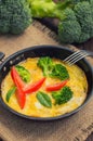 Frittata with herbs, tomatoes and feta cheese. Top view. Close-up Royalty Free Stock Photo