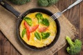 Frittata with herbs, tomatoes and feta cheese. Top view. Close-up Royalty Free Stock Photo