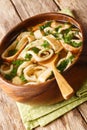 Frittatensuppe sliced pancake soup close-up in a plate. vertical Royalty Free Stock Photo