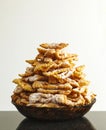 Fritters dusted with icing sugar. Traditional Italian and russian carnival food