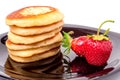 Fritters on a plate with strawberries isolated white background Royalty Free Stock Photo