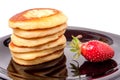 Fritters on a plate with strawberries isolated white background Royalty Free Stock Photo