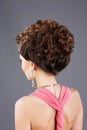 Frizzy Hair. Rear View of Brown Hair Woman with Festive Hairstyle