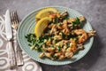Frog legs baked with garlic butter and parsley.