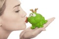 Frog price being kissed by a beautiful lady