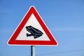 Frogs crossing the road warning sign