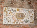 FROMBORK, POLAND. Stand with children `s drawings of Zodiac signs and a portrait of Nikolai Copernicus on a brick