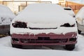 Front of abandoned car covered with snow. Royalty Free Stock Photo