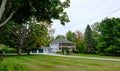 Front aspect view of a large, timber build residence in the style of an old colonial home in Salem, MA. Royalty Free Stock Photo