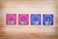 Front and back of floppy disk on wooden table Royalty Free Stock Photo
