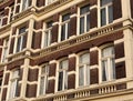 Front beautiful old house facade from red brick with white eyellow window frame. Vintage building. Netherlands Royalty Free Stock Photo