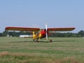 Front of beautiful Yakovlev Yak-12M SP-AWG airplane lands on grassy airfield in european Bielsko-Biala city in Poland