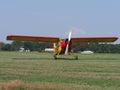Front of beauty Yakovlev Yak-12M SP-AWG airplane lands on grassy airfield in european Bielsko-Biala city in Poland