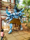 In Front of Big Shiva Statue Indian Mother and Girl Baby Watchin Royalty Free Stock Photo