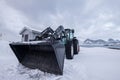 Front black wheel loader parked Royalty Free Stock Photo