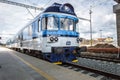 Front of a blue train shot from a platform