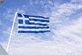 Front bottom shot of colorful waving greece flag with blue open sky background at Izmir in Turkey Royalty Free Stock Photo