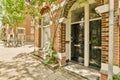 the front of a brick building with two black doors Royalty Free Stock Photo