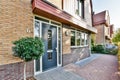 the front of a brick house with a blue door Royalty Free Stock Photo