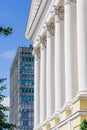 Front of Buildig with Columns and Skyscrapper on Background