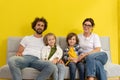 In front of the camera happy two kids and their parents moving in the new home they enjoy the time together playing Rock Royalty Free Stock Photo