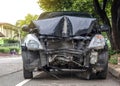 Front of car demolished from collision with electric pole.