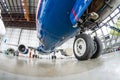 Front chassis rack airplane close-up in focus, background inside hangar. Royalty Free Stock Photo