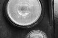 Front circular headlight of a vintage soviet car Royalty Free Stock Photo