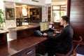 Front desk hotel receptionist working Royalty Free Stock Photo