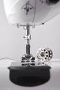 Front detail sewing machine needle and thread spool Royalty Free Stock Photo