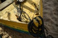 Front detail of a yellow boat docked on the beach sand Royalty Free Stock Photo